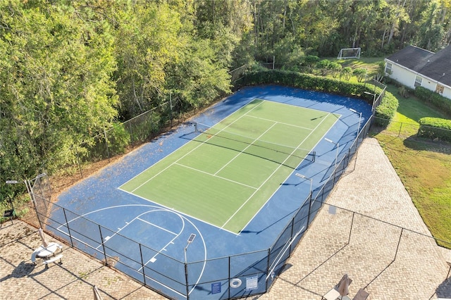 view of tennis court featuring basketball court