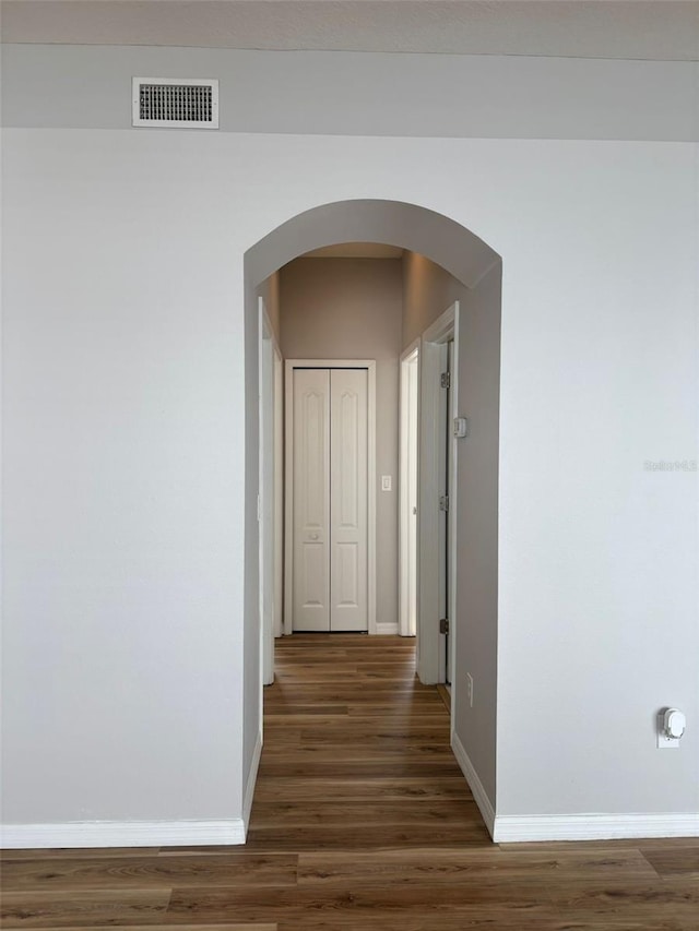 hallway featuring dark wood-type flooring