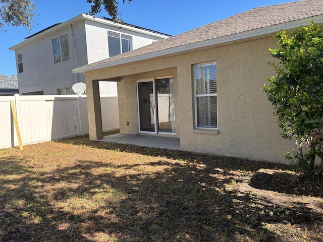 rear view of house with a patio