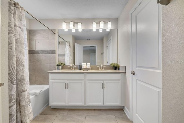 bathroom featuring shower / tub combo, vanity, and tile patterned flooring