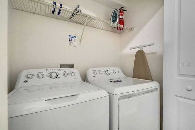 laundry area featuring washing machine and dryer