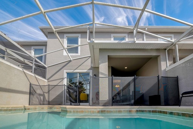 rear view of house with glass enclosure