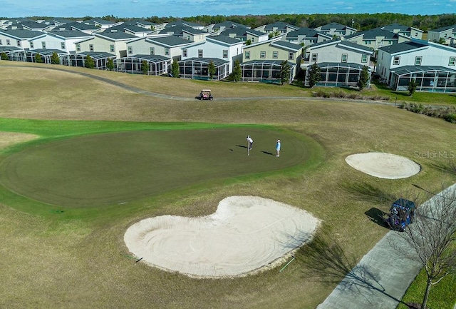 view of home's community with a lawn