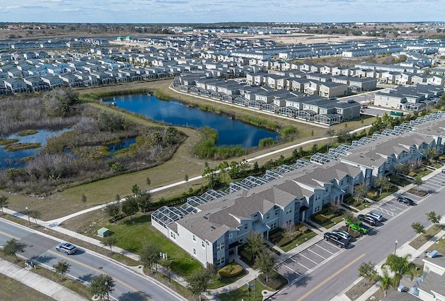 bird's eye view with a residential view and a water view