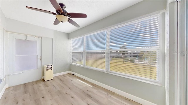 interior space featuring ceiling fan