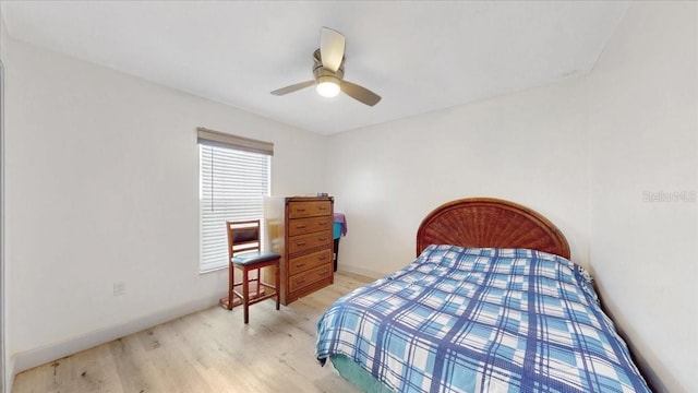 bedroom with ceiling fan and light wood-type flooring