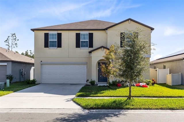 view of front of property with a garage and a front lawn