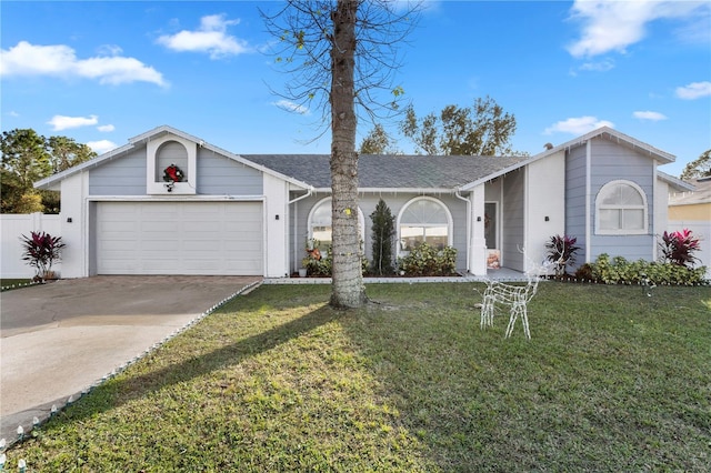 ranch-style home with a garage and a front lawn