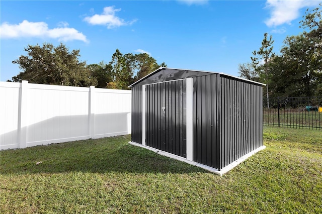 view of outbuilding featuring a yard