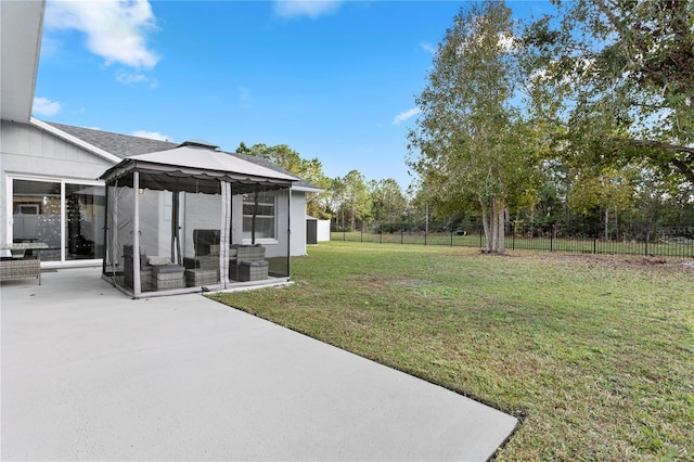 view of yard featuring a gazebo and a patio area