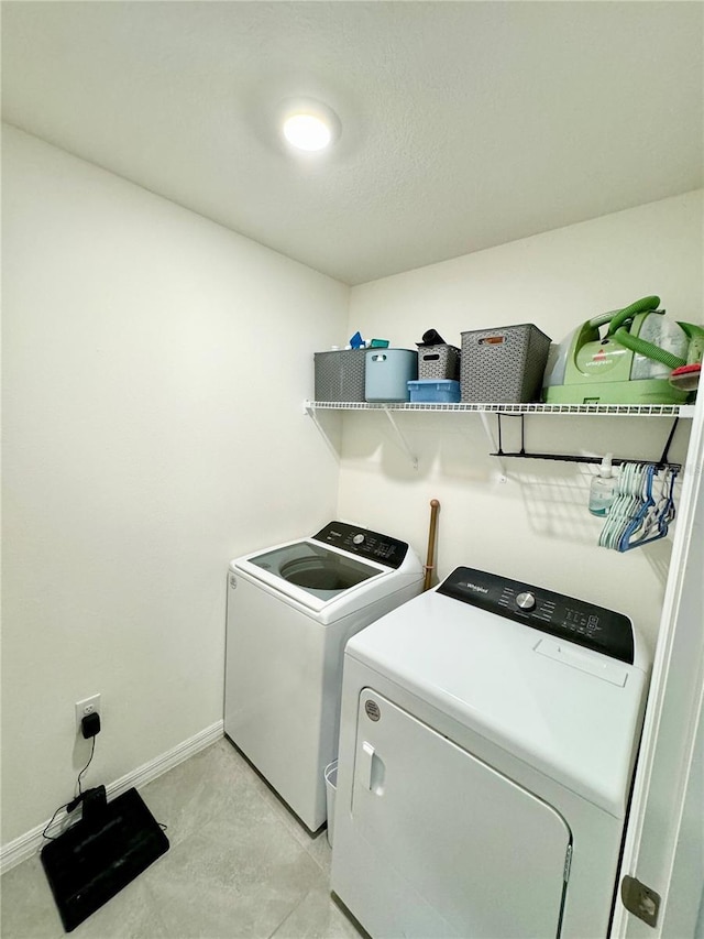 laundry room with separate washer and dryer