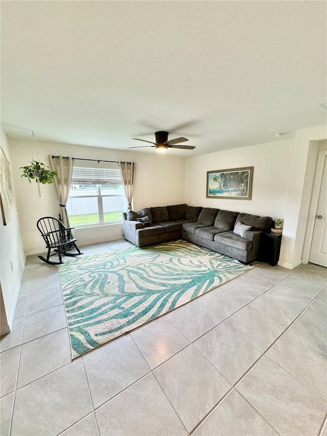 tiled living room featuring ceiling fan