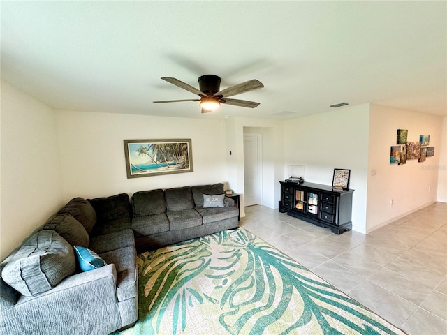 tiled living room with ceiling fan