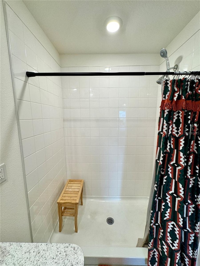 bathroom with a shower with shower curtain