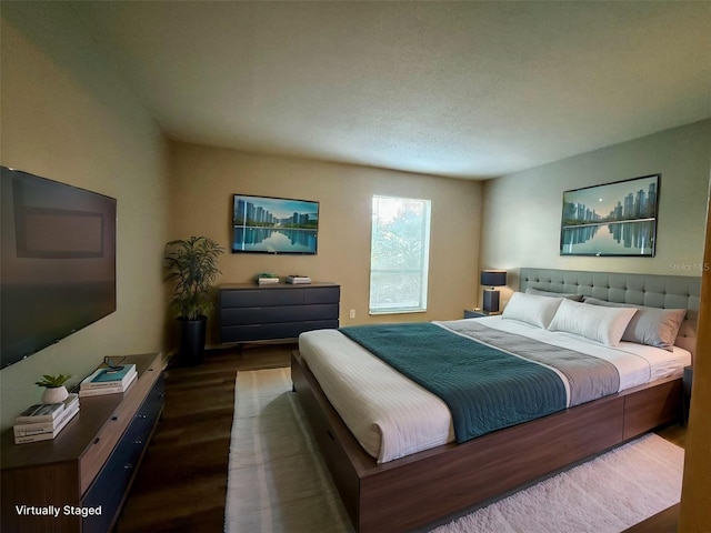 bedroom featuring dark hardwood / wood-style floors