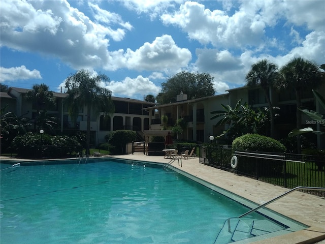 view of swimming pool featuring a patio area