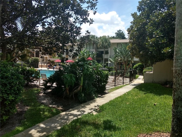 view of yard featuring a community pool