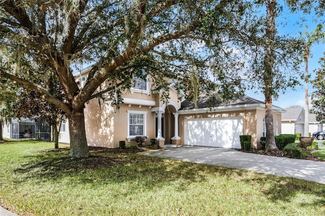 view of front of property with a garage and a front yard