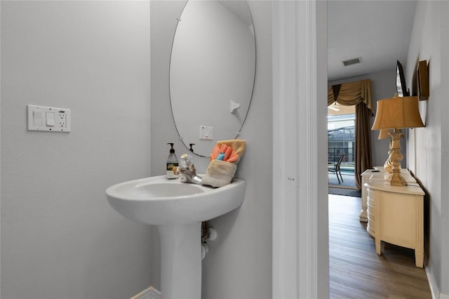 bathroom featuring hardwood / wood-style flooring