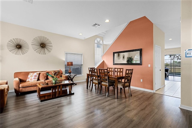 dining space with dark wood-type flooring