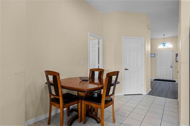 dining space with light tile patterned floors