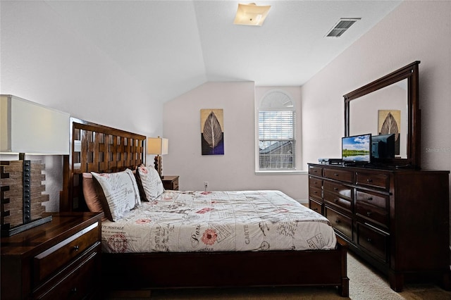 bedroom with light carpet and vaulted ceiling