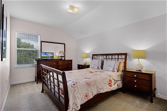 bedroom featuring light carpet and lofted ceiling