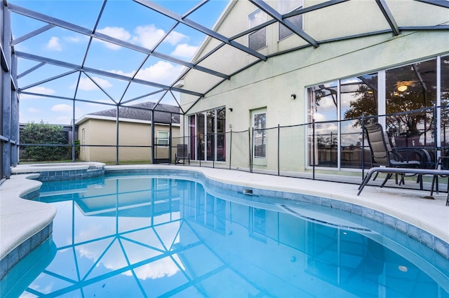 view of swimming pool with a lanai