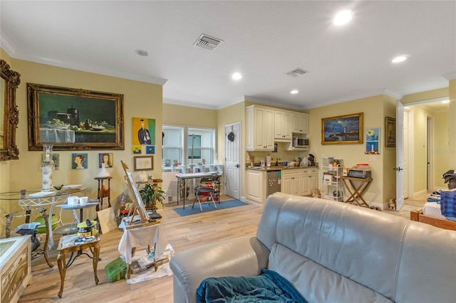 living room featuring light hardwood / wood-style floors and ornamental molding