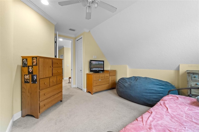 carpeted bedroom featuring ceiling fan, lofted ceiling, and crown molding