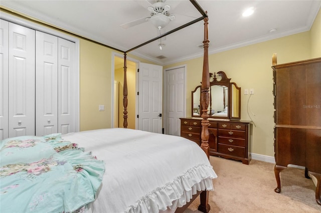 carpeted bedroom featuring ceiling fan and crown molding