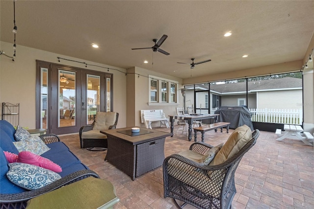 view of patio / terrace with french doors, an outdoor living space, grilling area, and ceiling fan