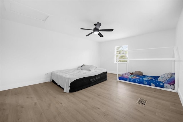 bedroom featuring hardwood / wood-style flooring and ceiling fan