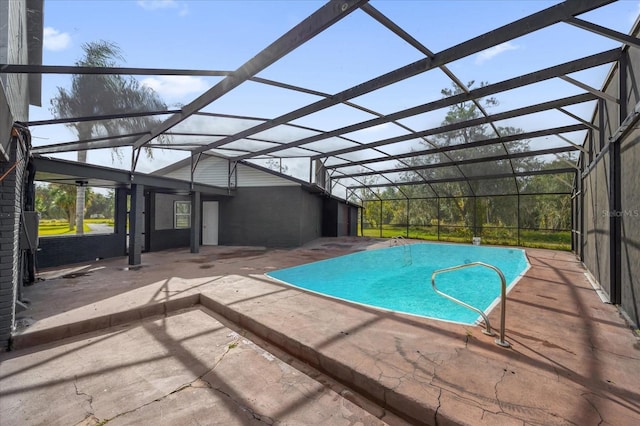 view of pool with a lanai and a patio area