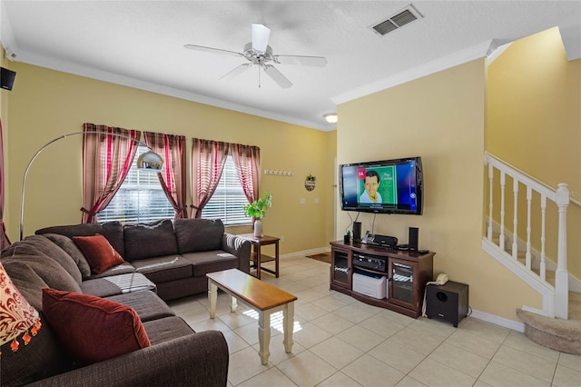 living room featuring ceiling fan, light tile patterned flooring, and ornamental molding