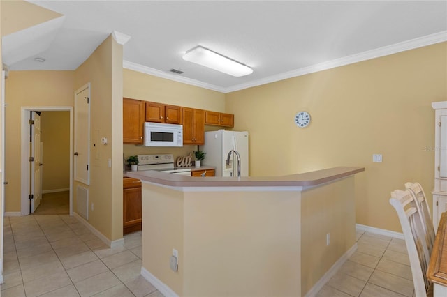 kitchen with light tile patterned floors, white appliances, ornamental molding, and an island with sink