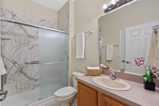 bathroom featuring vanity, toilet, and walk in shower