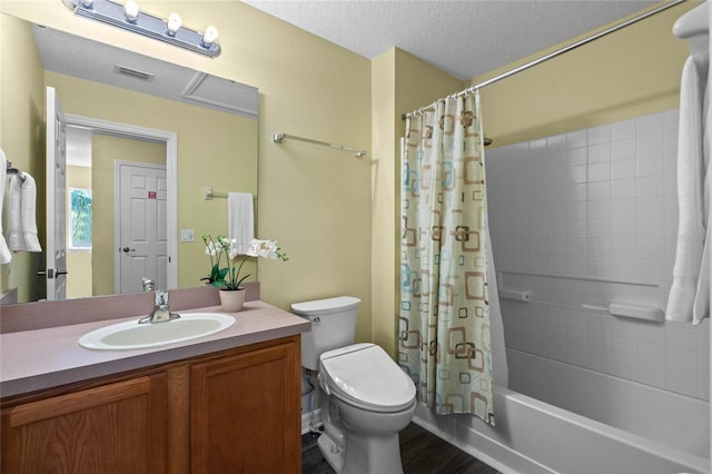 full bathroom featuring shower / bathtub combination with curtain, a textured ceiling, toilet, vanity, and hardwood / wood-style flooring