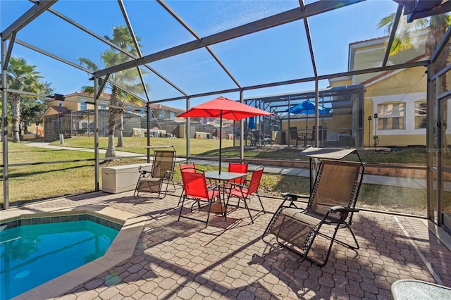 view of patio with glass enclosure