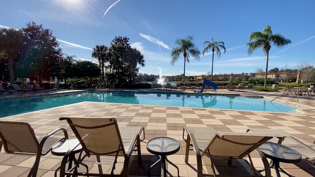 view of swimming pool with a patio