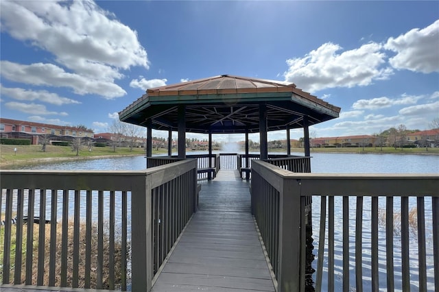 view of dock featuring a gazebo and a water view