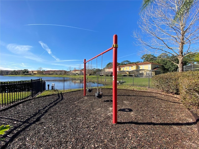 view of playground with a water view