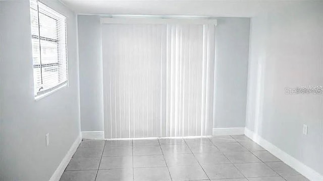 spare room with light tile patterned flooring