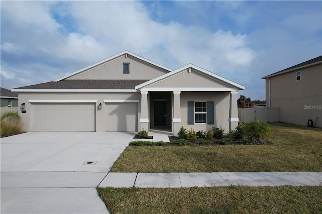 view of front of home with a garage and a front lawn