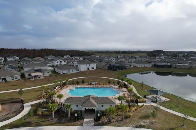 view of pool with a water view