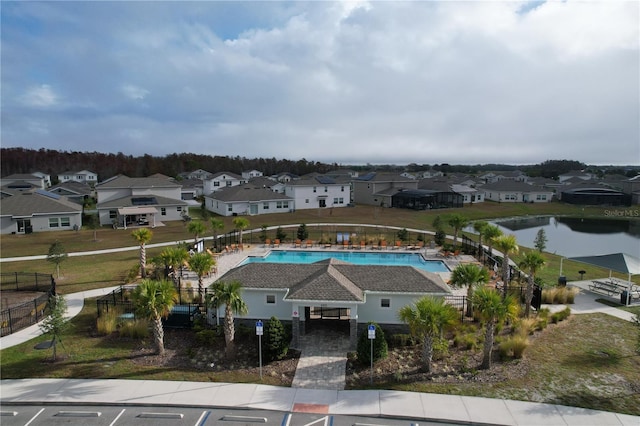 birds eye view of property with a water view