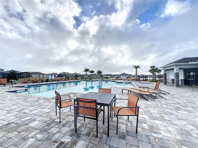 view of swimming pool featuring a patio area