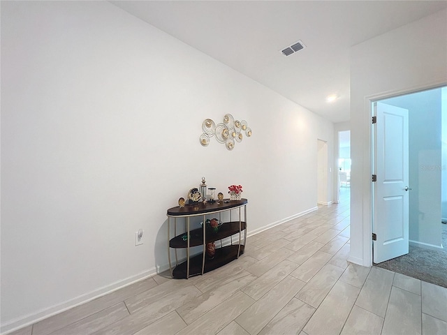 hall with light hardwood / wood-style flooring