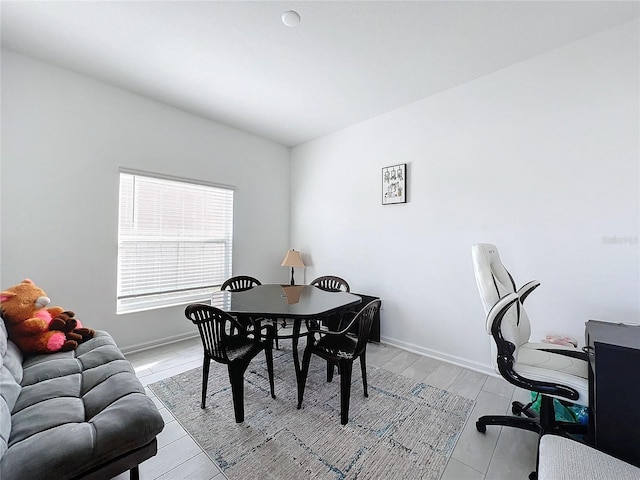 dining space with light wood-type flooring