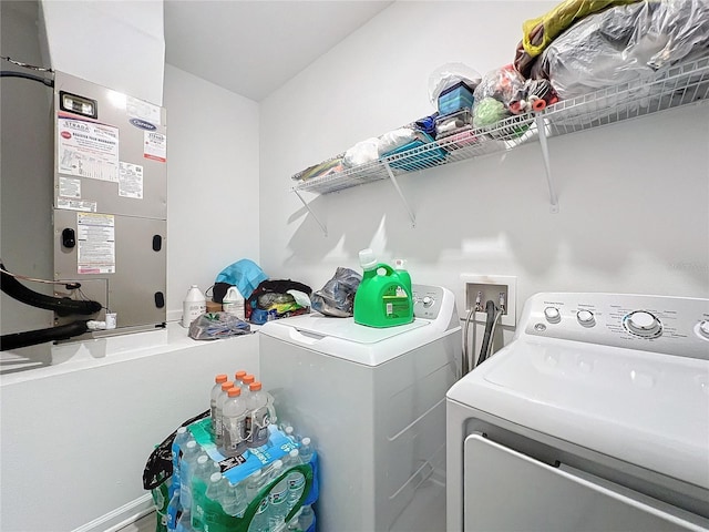 washroom with heating unit and washing machine and clothes dryer